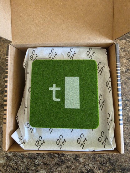Just opened Terminal.shop box which includes a "grass" coaster with the logo on it